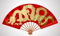 Red chinese fan with gold decorative gragon isolated on white Royalty Free Stock Photo