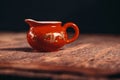 Red Chinese gaiwan on an old wooden table Royalty Free Stock Photo