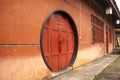 Red Chinese house with round door, Emeishan (Mount Emei) Sichuan, China