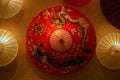 Red Chinese oil paper umbrella with dragon and pheonix drawings o