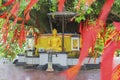 Red Chinese talisman with golden Buddha sculpture