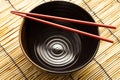 Red chopsticks and black bowl Royalty Free Stock Photo