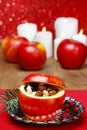 Red christmas apples stuffed with dried fruits in honey