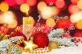 Red Christmas background with abstract bokeh light, red baubles, candle and green fir branch on snow. Merry Christmas composition Royalty Free Stock Photo