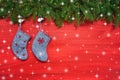 Red Christmas background. Christmas fir tree and Christmas socks on red wooden background. Copy space Royalty Free Stock Photo