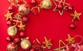 Red Christmas background with Golden baubles and stars