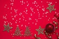 Red Christmas background. Christmas ornaments and golden stars on bright red background. Top view, copy space Royalty Free Stock Photo