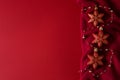 Red christmas background with red christmas toys on red knitted fabric Royalty Free Stock Photo