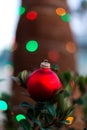 Red Christmas ball as traditional ornament in selective focus