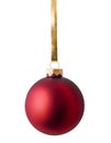 Red christmas ball hanging on golden ribbon isolated over white background Royalty Free Stock Photo