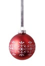 Red christmas ball hanging on silver ribbon isolated over white background Royalty Free Stock Photo