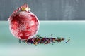 Red Christmas ball isolated on blue background. Close up. Traditional Xmas and Happy New Year Symbol. Royalty Free Stock Photo