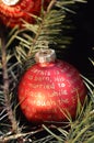 Red Christmas balls with golden lettering