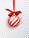 Red christmas ball with white diagonal stripes hanging on a ribbon with a red lush bow isolated on a transparent Royalty Free Stock Photo