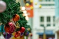 Red christmas Balls Bauble hanging on green blurry garland Royalty Free Stock Photo