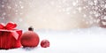 Red christmas balls and gift box on snow with bokeh background Generative AI Royalty Free Stock Photo