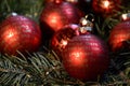 Red Christmas balls with golden lettering