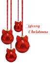 Red christmas balls hanging on ribbon bow, over white Royalty Free Stock Photo