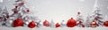 Red and silver Christmas balls in a row with white trees covered with snow. Royalty Free Stock Photo