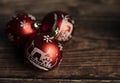 Red christmas balls on wooden background