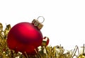 Red christmas bauble with gold tinsel