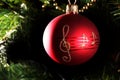 A red christmas bauble with musical notes Royalty Free Stock Photo