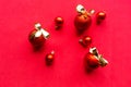 Red Christmas baubles with golden bows on red background. Royalty Free Stock Photo