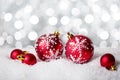 Red Christmas Baubles on the shiny background. Very shallow depth of field. Selective focus