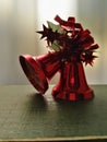 A red Christmas bell standing on the surface. Royalty Free Stock Photo