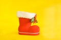 Red Christmas boot with gift on background Royalty Free Stock Photo