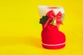Red Christmas boot with gift on background Royalty Free Stock Photo