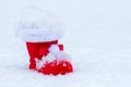 Red christmas boot in snow with snowflake and white background