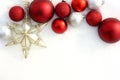 Red Christmas Bulbs and Star in White Snow Border Royalty Free Stock Photo