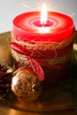 Red Christmas candle and Christmas ornaments Royalty Free Stock Photo