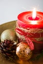 Red Christmas candle and Christmas ornaments Royalty Free Stock Photo