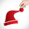Red christmas cap in hand Royalty Free Stock Photo