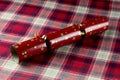 Red Christmas Cracker on a Tartan Table Cloth Royalty Free Stock Photo