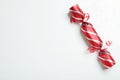 Red Christmas cracker on white background, top view. Space for text Royalty Free Stock Photo