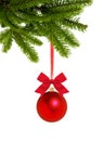 Red Christmas decor ball on green tree branch isolated on white Royalty Free Stock Photo