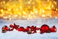 Red christmas decoration snow golden bokeh background Royalty Free Stock Photo