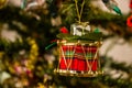 Red Christmas drum ornament hanging from Christmas tree Royalty Free Stock Photo