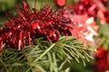 Red Christmas Garland with artificial snow on Christmas Tree Royalty Free Stock Photo