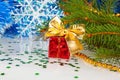 Red Christmas gift with a bow under the Christmas tree Royalty Free Stock Photo