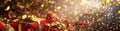 Red christmas gift boxes with gold ribbons are laying on a surface with golden and red confetti exploding in the background Royalty Free Stock Photo