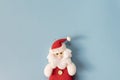 Red christmas hand made toy over the blue background with copy space for text. Cute Santa Claus toy close up. Top View, mockup Royalty Free Stock Photo