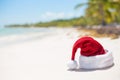 Red Christmas hat on the beach Royalty Free Stock Photo