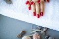 Red Christmas manicure make in beauty studio on Christmas background Royalty Free Stock Photo