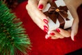 Red Christmas manicure make in beauty studio on Christmas background Royalty Free Stock Photo