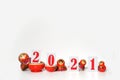 Red christmas numbers 2021 combined with russian nesting dolls on isolated white background. russian doll matryoshka Holiday Royalty Free Stock Photo