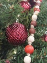 Red Christmas Ornament and Beads Hanging on a Christmas tree Royalty Free Stock Photo